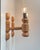 A set of 2 wall lamps fashioned from engine turned oregon pine. Designed and made in-house by hs belysning in denmark...