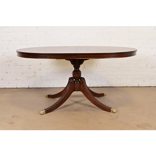 An exceptional Georgian or Regency style pedestal extension dining table or breakfast table In the manner of Baker...