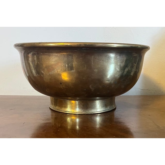 Antique 18th century Dutch brass footed fruit bowl. Heavy weight with concentric hand chased lines at the rim and foot....