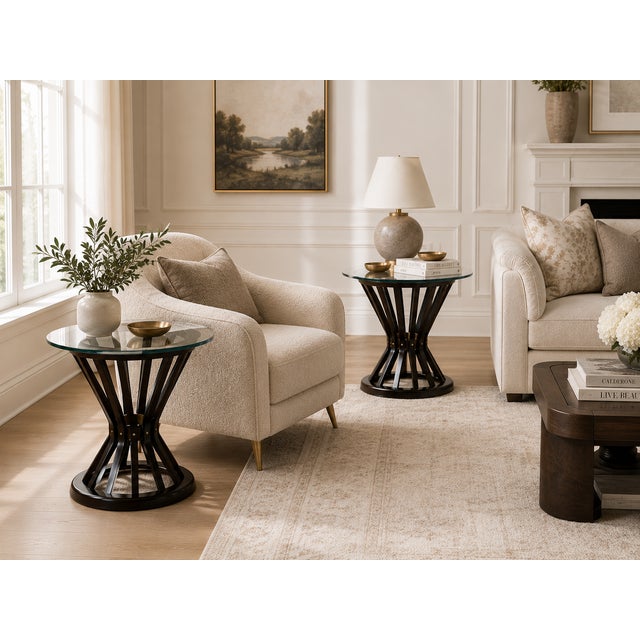An exceptional pair of round side tables designed by Edward Wormley for Dunbar Furniture, featuring the iconic sheaf of...