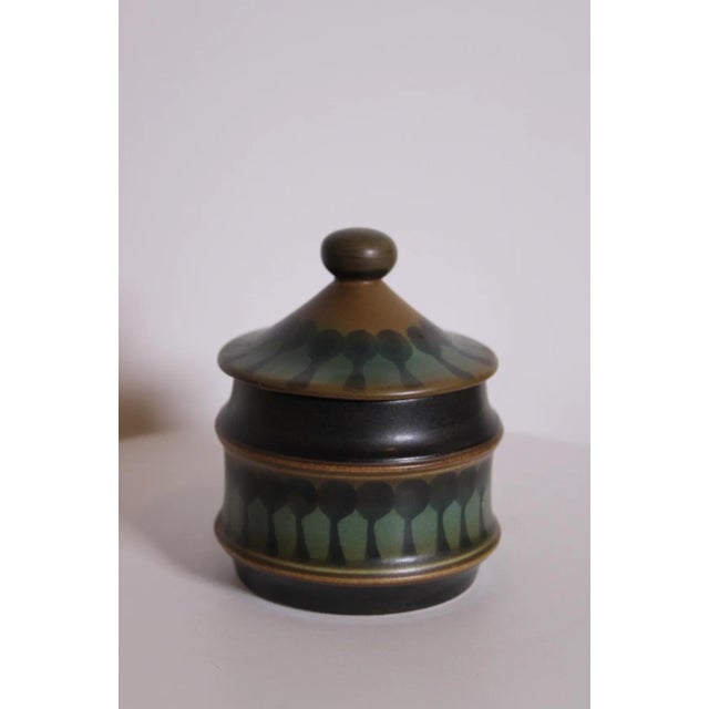 Vintage Goebel Wallis stoneware mustard jar with its iconic earthy glaze and timeless Mid-Century design. Size: Height:...