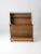 An antique primitive storage chest featuring a rustic bead-board construction, large trunk-style storage compartment, and...