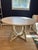 Gabby Home Kendleton Round Dining Table with Brass Inlay