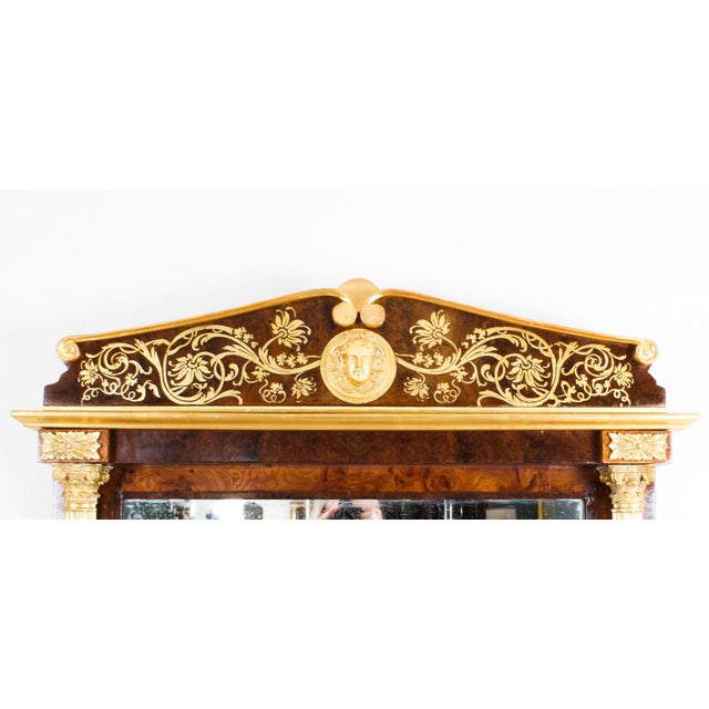 A beautiful antique French burr walnut and parcel gilt mirror, circa 1880 in date. The rectangular mirror features a...