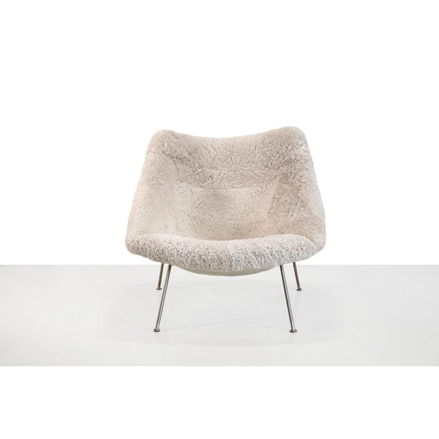 Beautiful newly upholstered F157 armchair together with original ottoman, designed by Pierre Paulin for Artifort. This...