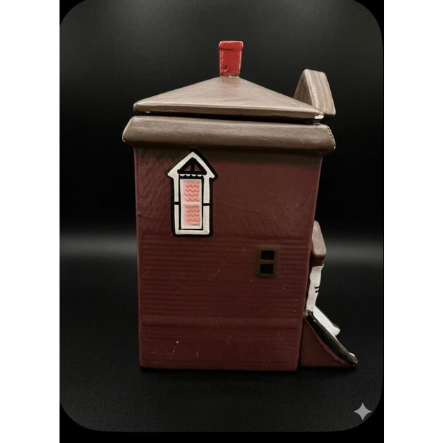 Bring a touch of whimsical, architectural charm to your home with this delightful ceramic piece. Perfectly capturing the...