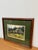 Design Plus Gallery presents a Wood Framed Landscape Watercolor. The piece has a thick green matte with an artwork showing...