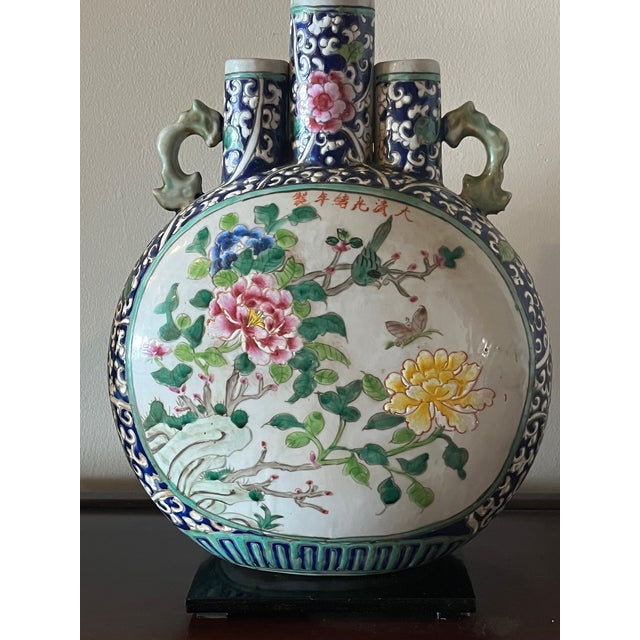 A superb, authentic pair of Chinese Famille Rose moon flask (Bianhu) vases dating to the Late Qing Dynasty (c. 1880–1900)....