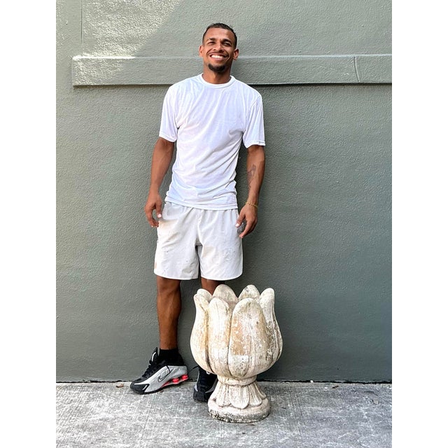 Elevate your garden or interior with this striking vintage tulip-shaped planter, a masterclass in organic form and...