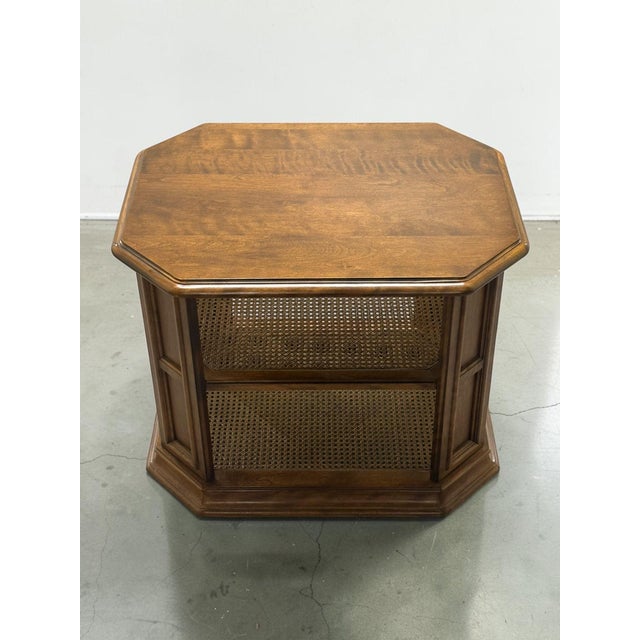 The Ethan Allen Manor Side Table is a beautifully crafted example of classic American furniture design. Constructed from...