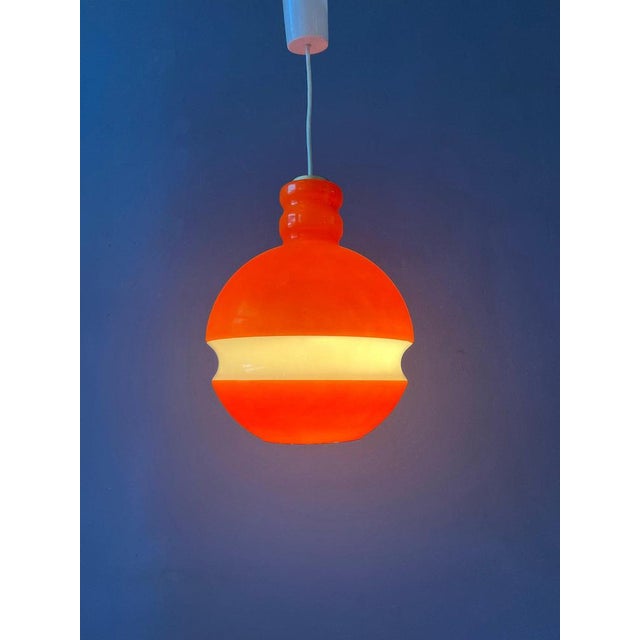 Orange Peill & Putzler space age glass pendant lamp. The orange and white parts together produce an amazing light effect....