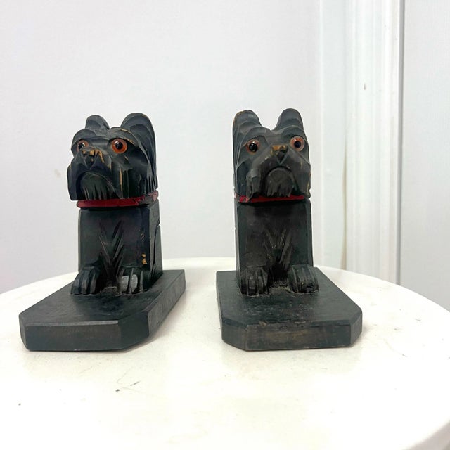 **Vintage Carved Wooden Dog Bookends - Pair** Add a touch of vintage charm to your home or office with this unique pair of...