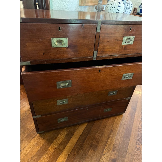 Handsome old campaign chest. Lovely worn wood and hardware. 5 drawers (2 over 3). Top drawers separate from bottom 2...