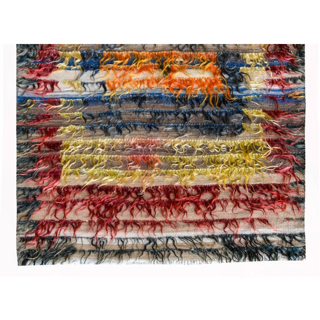 A vintage Turkish Tulu runner with two large color-blocked medallions woven in crimson, indigo, orange, and yellow goat wool.