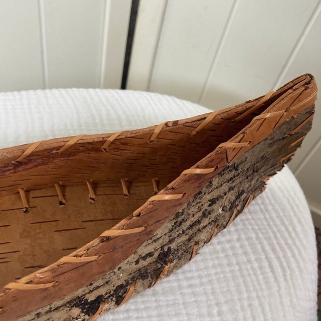 Charmingly rustic, this vintage handmade canoe model double-functions as a unique catchall basket, bringing an authentic...