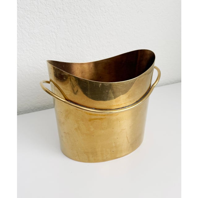 A wonderful Italian-crafted, unlacquered brass dual bottle chiller or larger ice bucket. Circa 1970s, marked Bora's, made...