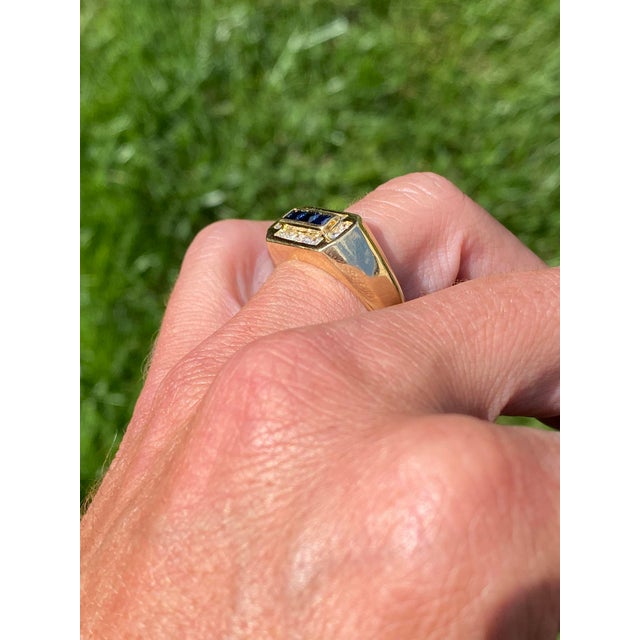 The Coolidge Road: French Cut Sapphire and Diamond Gentleman Ring. The ring features three French-cut natural sapphires in...