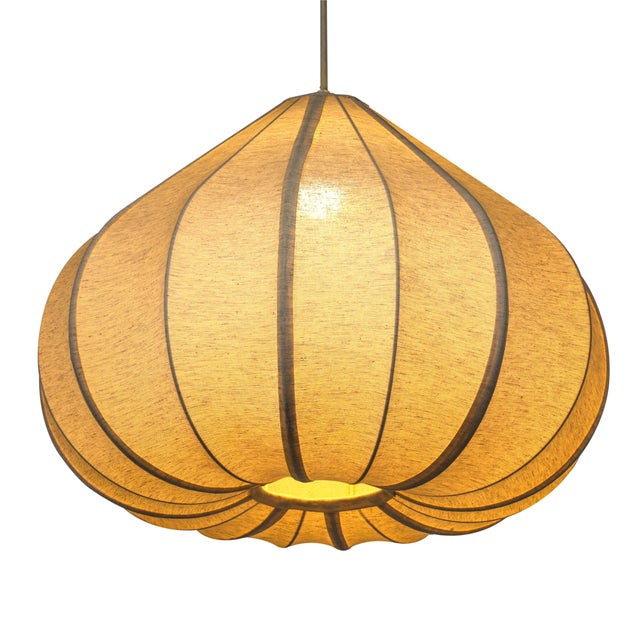 Transform any room into a haven of calm with the Zubeda Pendant Lamp. Its teardrop shape and flowing curves bring a...