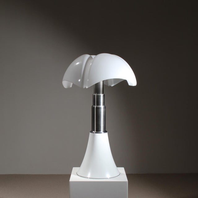This iconic table lamp was designed by Gae Aulenti. The design dates back to 1965, and this specific piece in the large...