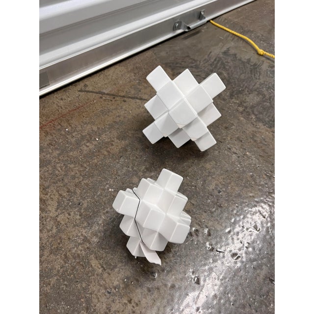 unusual set of " sculptural " puzzle pieces in white ceramic. love these on end table or coffee table or on a tray with...