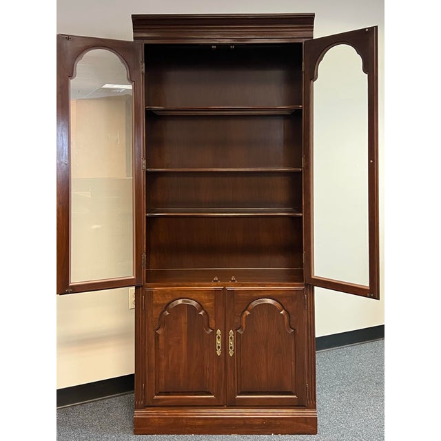 Timeless lighted display cabinet from Ethan Allen’s celebrated Georgian Court Collection (Model 11-9210). Meticulously...