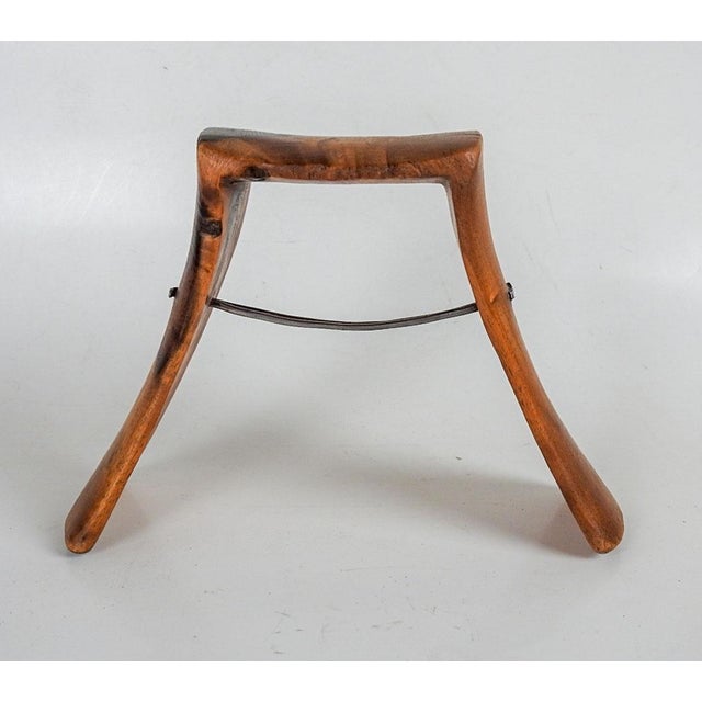 Vintage handcarved wood and iron neck rest. Beautiful grain to wood, very sculptural shape, carved form one piece of wood....