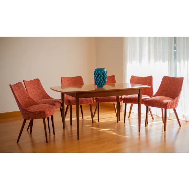 A G-plan Danish range of a dining room set comprising an extending rectangular walnut dining table together with 6 G-Plan...