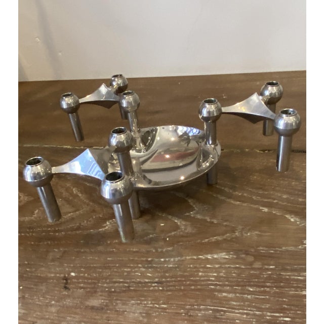 A beautiful set of three nagel candlesticks and one saucer that can be stacked and arranged as you wish. these pieces are...