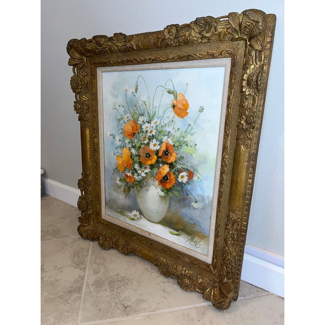 This is a beautiful vintage floral oil painting on canvas, signed by Artist Alex, and framed in an ornate, heavy gilded...