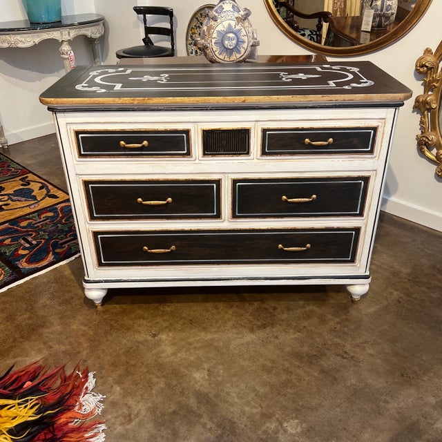 Hand painted black and white chest featuring five drawers and Gold Gilt Trim. Created in Italy.