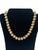 This vintage MONET necklace boasts an elegant and chic style with its brushed gold tone and beaded strand design. Marked...