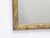 This gilt fauxbois form mirror measures 24"H x 21"W.