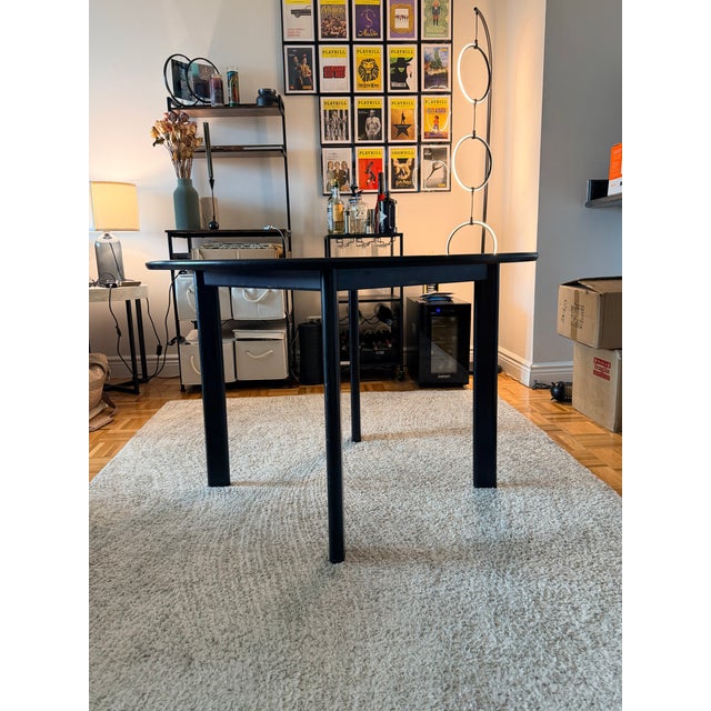 Joseph D’Urso for Knoll 42-inch round dining/work table in black, featuring D’Urso’s signature minimalist design with a...
