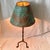 Forged Iron three leg lamp with pierced copper shade.