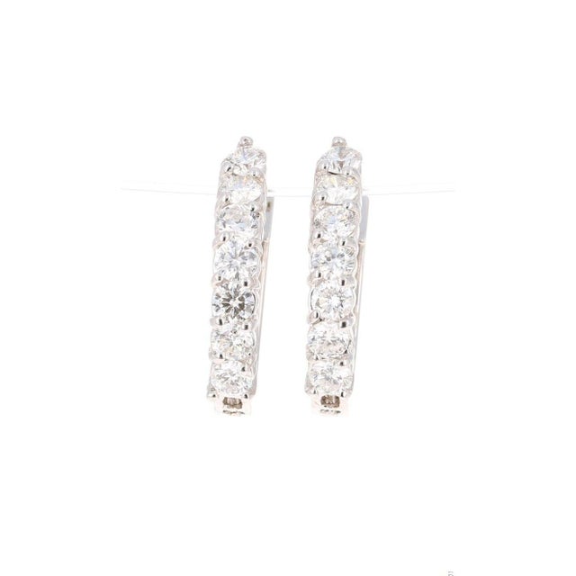 These versatile beauties are great every day earrings or special event earrings. 14 Round Cut Diamonds that weigh 1.05...