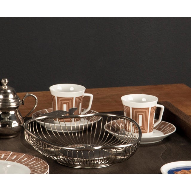 Mid Century Modern. Elegant. Clear. Expressive. Timeless. At the heart of this design is a porcelain coffee cup in the...