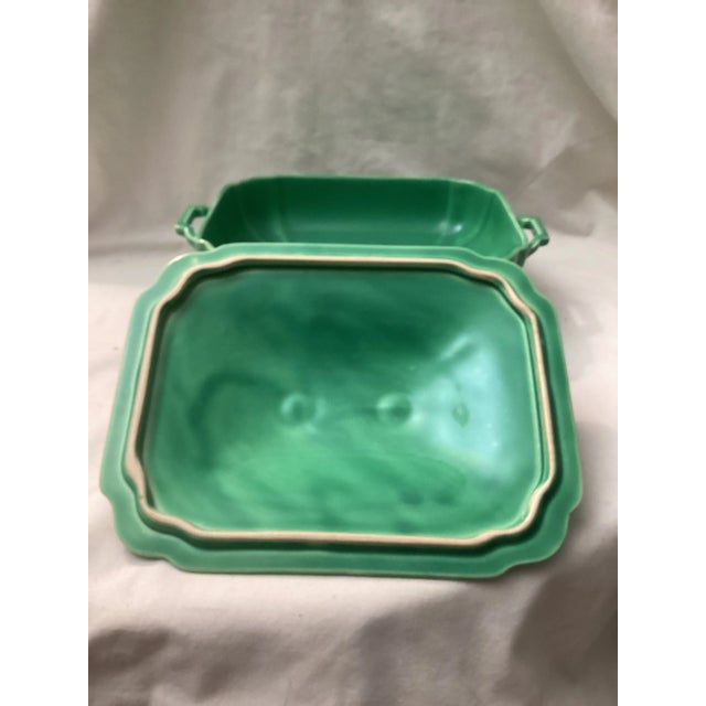 Crafted in sturdy glazed, ceramic it features a striking green finish with ivory accent trim. The squared body is designed...