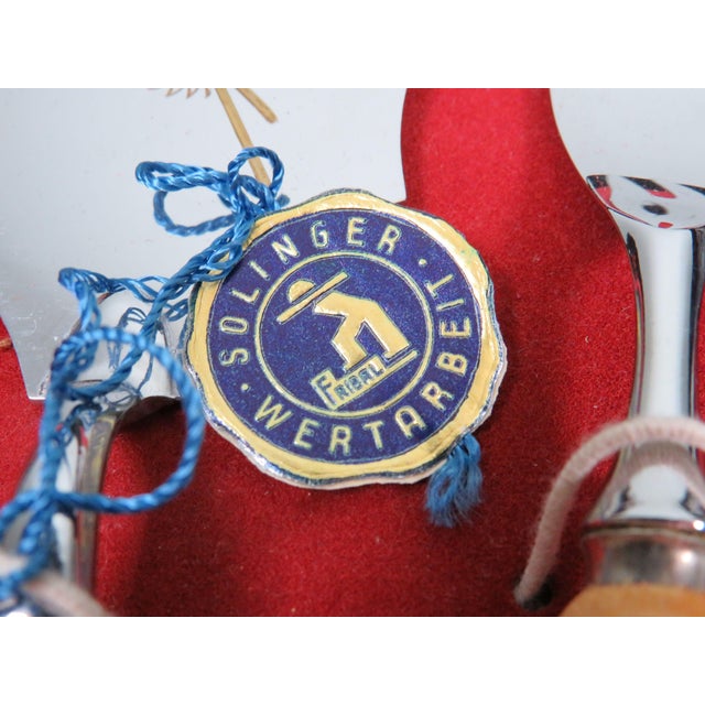 Mid-century German cake serving set manufactured in Solingen during the 1960s. The set consists of six dessert forks and a...