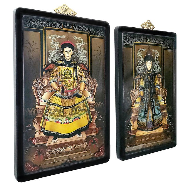 Offering a pair of reverse hand painted on glass of Chinese Emperor and Empress portrait paintings, circa 1940s. These...