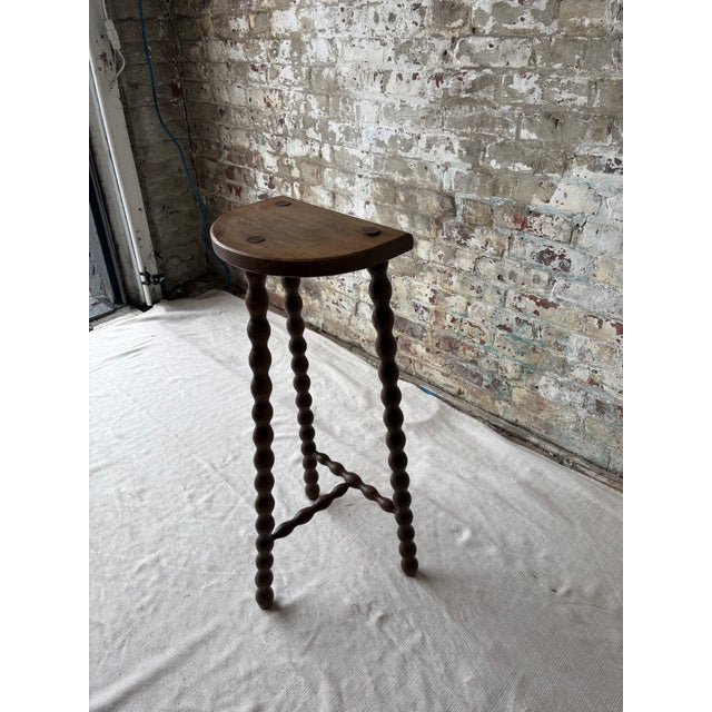 Charming vintage demi-lune stool featuring beautifully turned barley twist legs and matching stretcher supports, crafted...