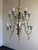 A spectacular Italian painted and giltwood chandelier, early 20th century, in the Baroque and Rococo revival taste. This...