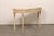 An Italian carved and painted wood console table, with marble top, from the mid 20th century. This vintage table from...