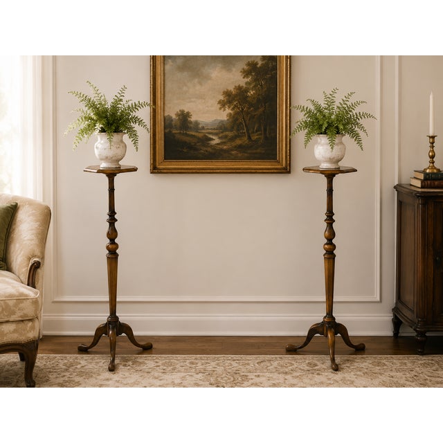 We are pleased to offer this pair of 1940s Mahogany Torchere Tripod Side/Plant Stand Tables. Elegantly crafted, each table...