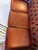 Classic three-seat Chesterfield (1979) in a rich oxblood leather with deep button tufting, rolled arms, and brass nailhead...