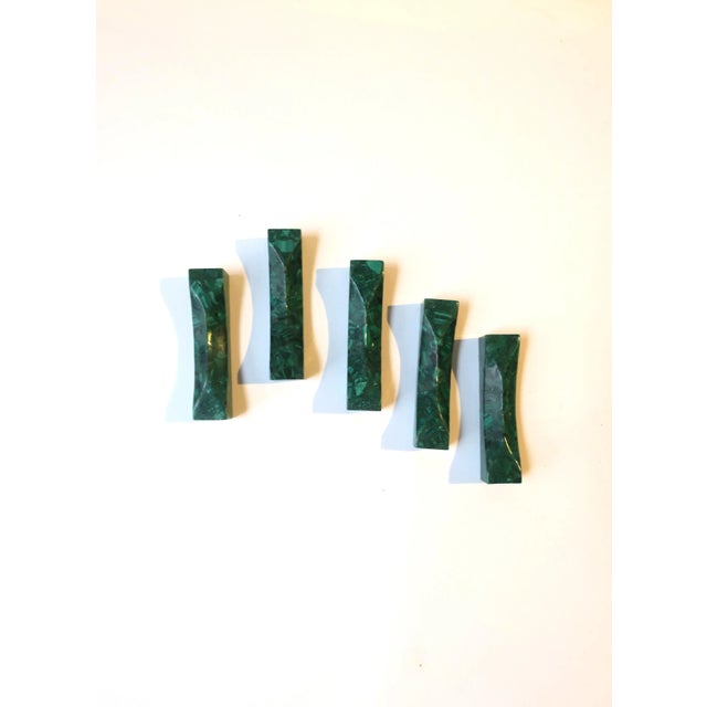 A beautiful and chic set of five (5) natural green malachite utensil rests, circa mid-20th century. Shown in images...