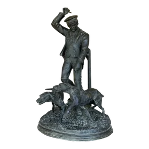 Vintage Boho Patinated Metal Man With Hounds Sculpture