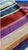 The Missoni Home Cesar Striped Tub Mat is a colorful and patterned textile element that adds a dynamic and original touch...