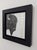 This artwork features a meticulously rendered bison, its textured fur captured in intricate graphite detail against a...