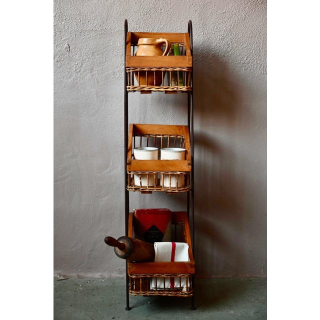 This charming 1960s freestanding shelf is delightful. It combines black wrought iron, light wood, and woven wicker in a...