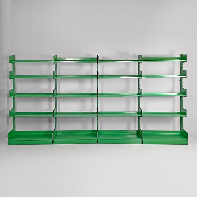 Italian modern green metal bookcase, 1970s Bookcase entirely in green metal with four bays. The shelf supports and shelves...